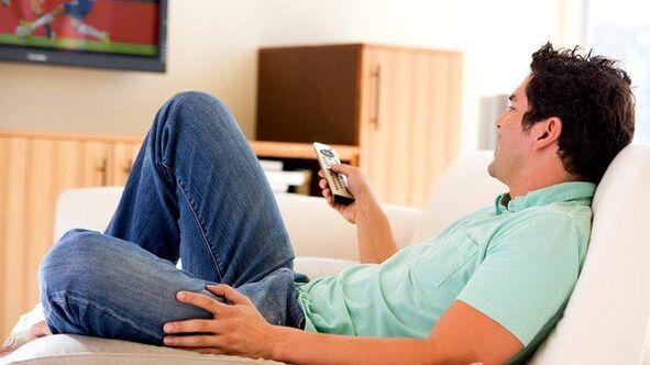 The man watching TV